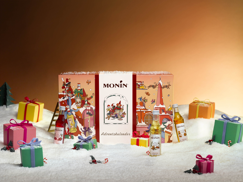 MONIN Adventskalender mit Sirup-Miniaturen in weihnachtlicher Geschenkdekoration
